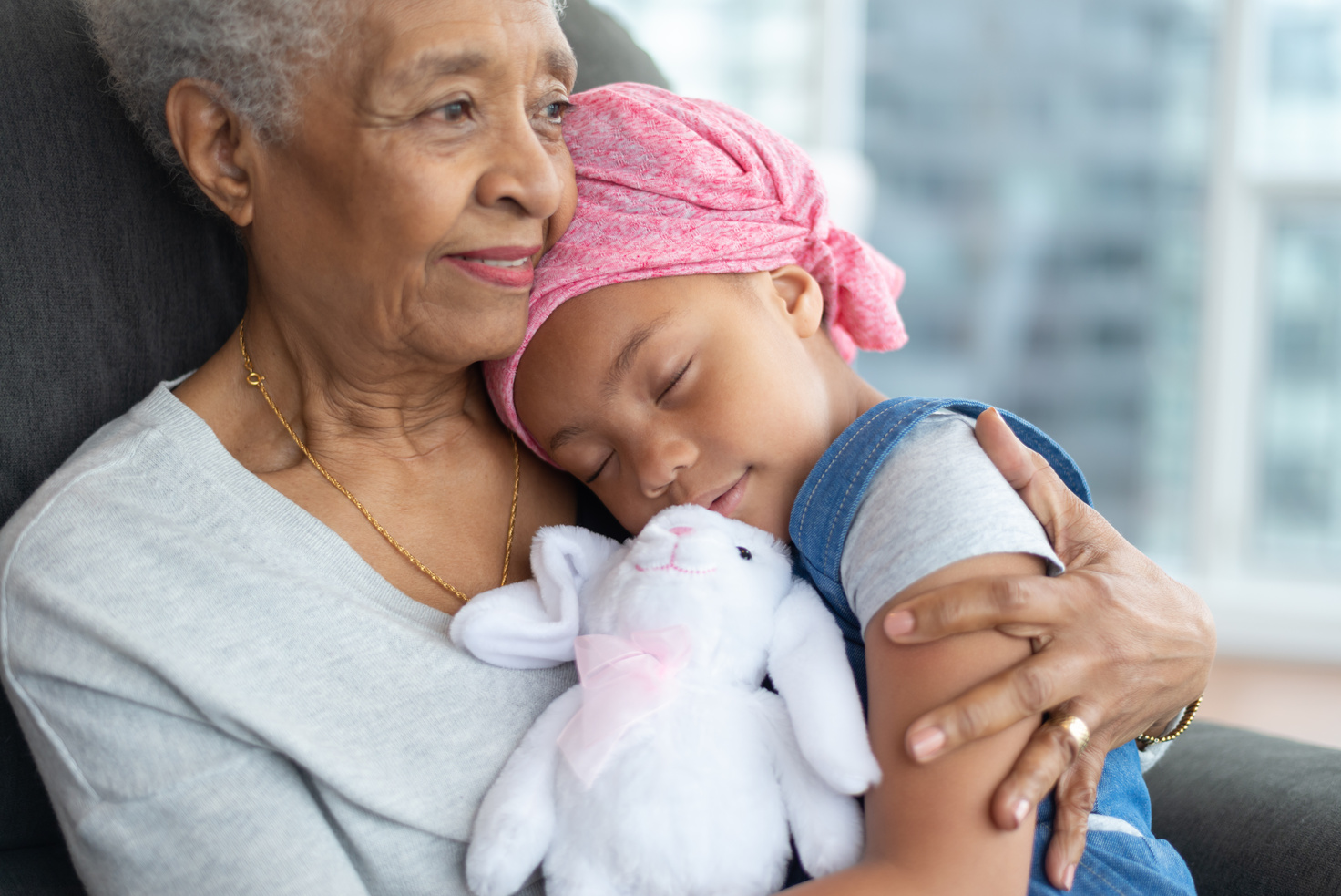 Woman embraces granddaughter with cancer